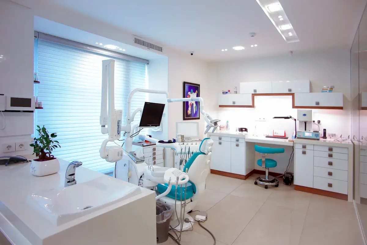 Modern dental practice treatment room with clean equipment and natural light